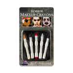 Packaged horror makeup crayons with a gray background
