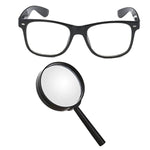 Black-framed glasses and a magnifying glass on a white background