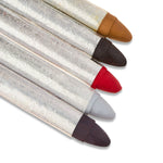 Set of lip pencils with different colored caps on a white background