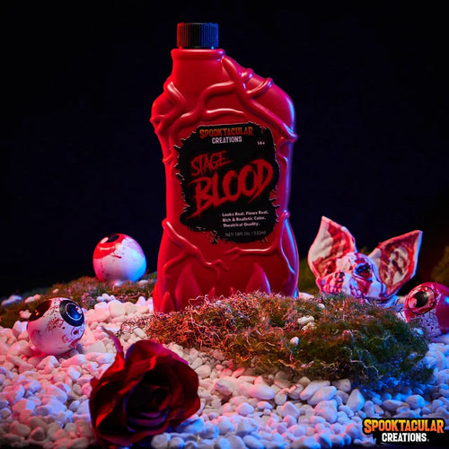 Red bottle labeled 'Sage Blood' with Halloween-themed decorations on a dark background